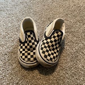 Checkered Vans slip ons